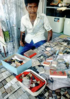 Tattoos: Shopkeeper with his wares, Thailand
