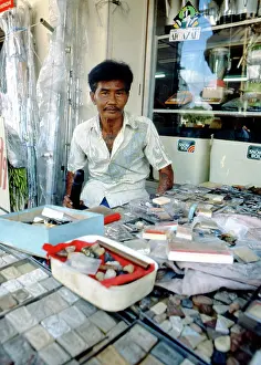 Tattoos: Shopkeeper with his wares, Thailand