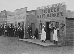Manifest: Shopkeepers and customers pose in doorways