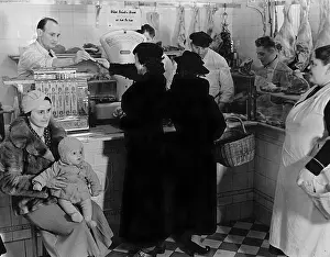 Butchers: Shopping at a butchers, 1936