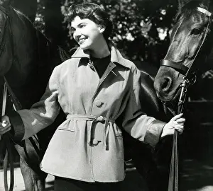 Tops: Short-haired brunette model with lightweight outdoor jacket