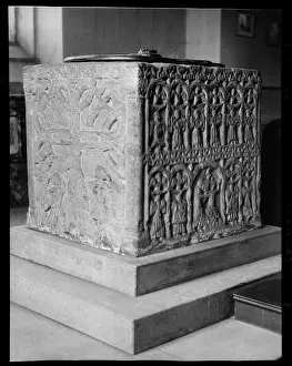 Cubical: Detail of two sides of a 12th century cubical font