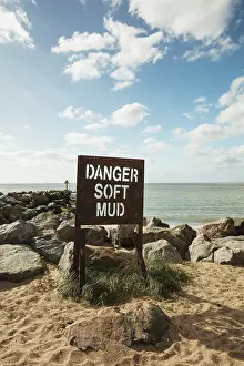 Jaywick: Sign on the beach reading Danger Soft Mud
