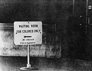 Accommodations: Sign reading waiting room for colored only, ?
