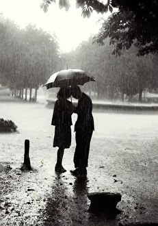 Feel: Silhouette of couple in rain