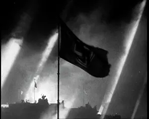 Searchlights: A Silhouette of a Waving Flag Against an Illuminated