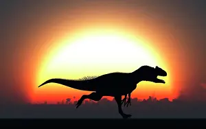 Allosaurus: A silhouetted Allosaurus sprinting against a setting Sun at