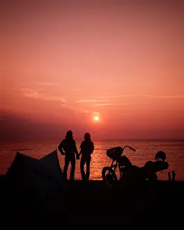 Crs001: Silhouetted Anonymous Couple Holding Hands Looking