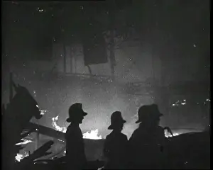 Extinguish: Silhouetted Firefighters Trying to Extinguish