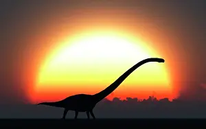 Omeisaurus: A silhouetted Omeisaurus walks pass the rising Sun at the ?