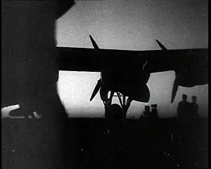 Silhouetted: A Silhouetted RAF Pilot Entering a Plane