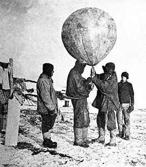 Inflating: Simpson inflating a weather balloon, South Pole exploration