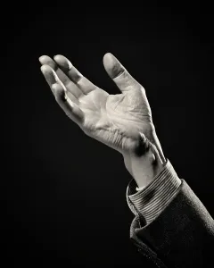 Handout: Single Male Hand Reaching Out to Lend a Helping