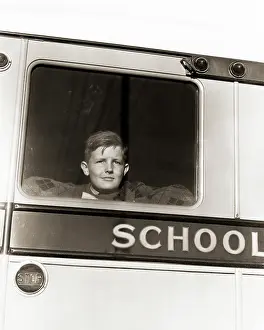 Sincere: Single Serious Young Boy Looking out of Back Window