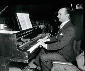 Tripe: Sir Malcolm Sargent, conductor, playing piano