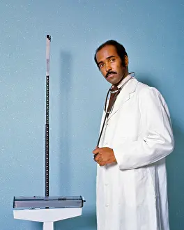 Impairment: Serious Skeptical African-American Doctor looking