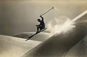 Downhill: A skier performing stunts downhill