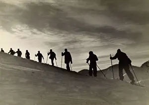 Trudge: SKIERS CLIMBING HILL