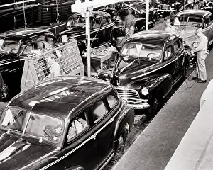 Cpc001: Skilled Crew of Anonymous Men Working on Automobile