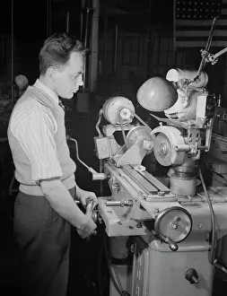Grinding: A skilled worker grinds permanent magnet rotors