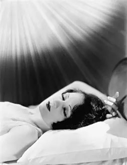 Jmlook: Sleeping woman with beams of light
