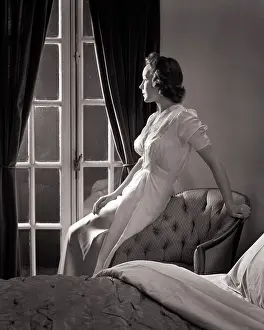 Sleepless: Sleepless Woman Looking Out of Bedroom Window