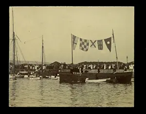 Quayside: Small boat dressed with flags