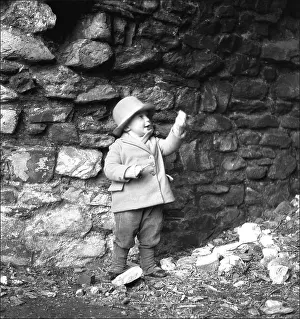 Ponsonby: Small boy in front of a wall