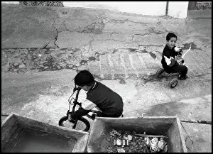 Malaga: Small boys playing in the street, Malaga, Spain