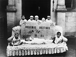 Chintz: Small children posing with large Christmas card