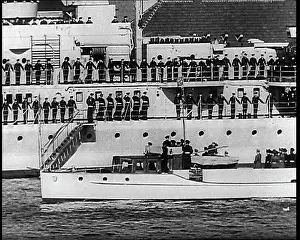 Motorboat: A Small Motorboat Driving Past a Warship