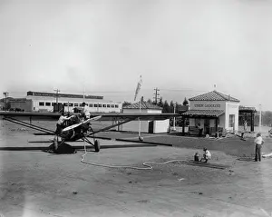 Refuels: A small plane refuels at a gas station