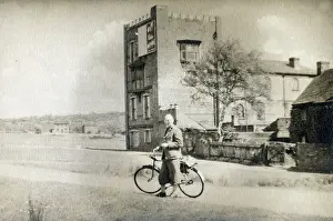 Pauses: A smart gentleman out for a cycle - an unidentified location