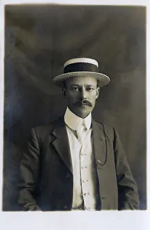 Good Looking: Smart and Handsome British Gentleman in straw boater hat