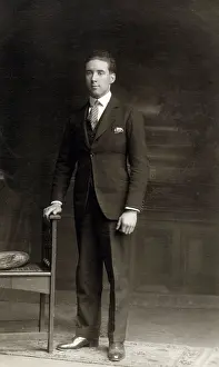 Stiff: Smart young man posing for a Studio photograph