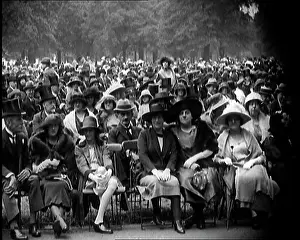 Smartly: Smartly Dressed Civilians Sitting in Chairs