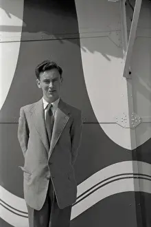 Nigel Sorrell: Smartly-dressed young man - patterned backdrop