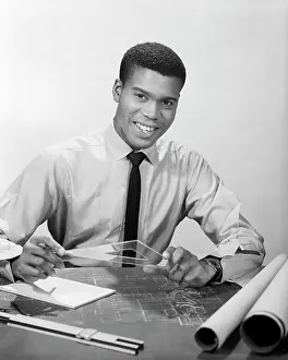Drafting: Smiling African-American Man working on Drafting