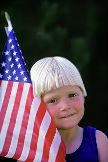 Fel001: Smiling Blond Boy Holding American Flag Looking