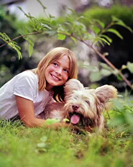Pht001: Smiling Blond Girl Lying in Grass Playing with