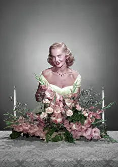 Centerpiece: Smiling Blond Woman Looking at Camera
