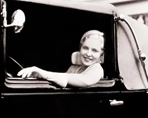 Smiling Blonde Woman Looking at Camera Out of