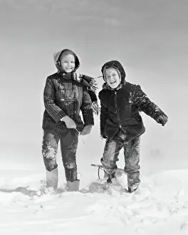 Esteem: Smiling Boy Girl Pulling Sled in Winter Snow