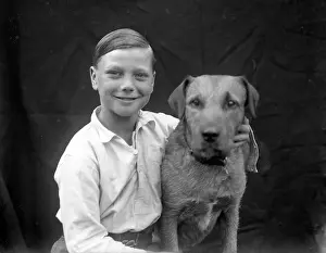 Barnabys: A smiling boy and his terrier dog