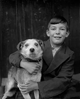Barnabys: A smiling boy and his terrier dog