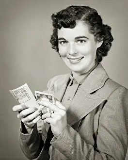 Paycheck: Smiling Brunette Woman Looking at Camera Opening