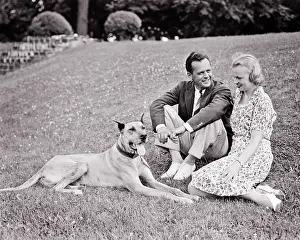 Stylishly: Smiling Couple Stylishly Casually Dressed Sitting