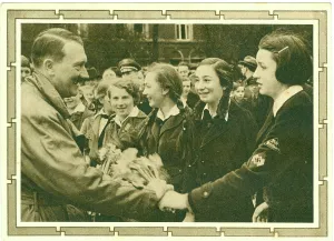 Braunau: Smiling Hitler shaking hands with Deutche Madchen