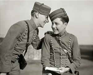 Bellhop: Two Smiling Hotel Bellhops in Uniform Sharing