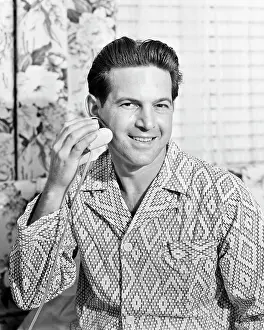 Shaver: Smiling Man in Bathroom Wearing Pyjamas